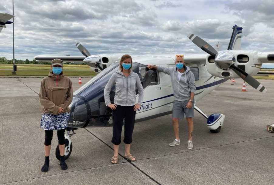 Danish team MiniSCANS II in front of a plane