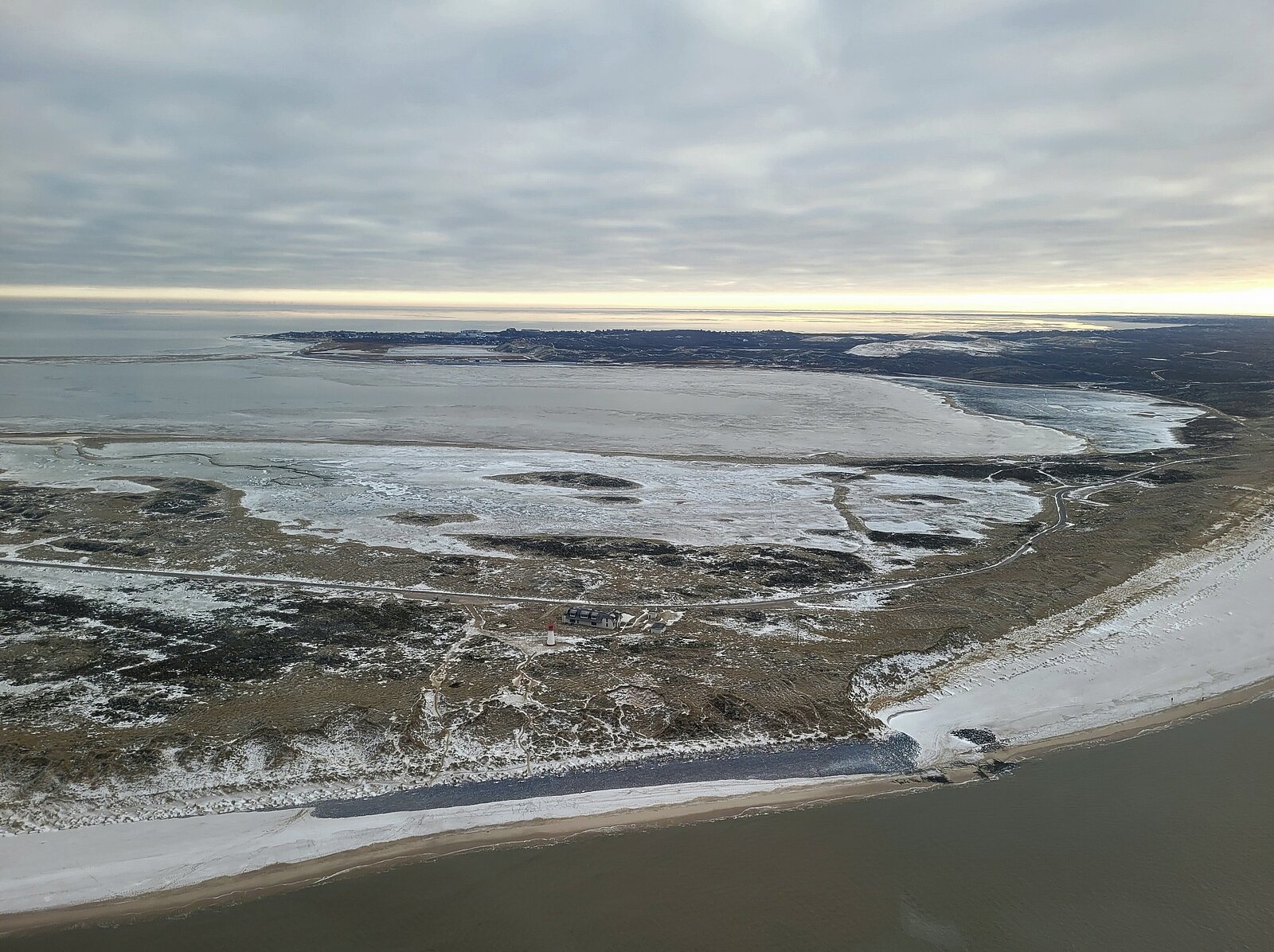Photo of coast in winter taken from plane