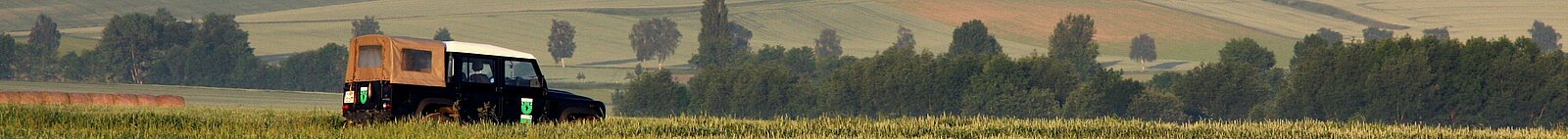 Landrover, crossing a field