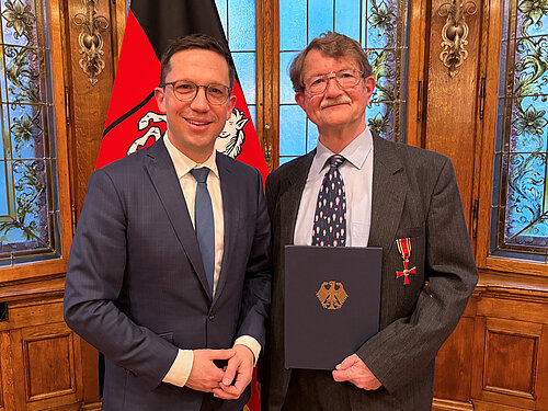 Minister Falko Mohrs und Prof. Dr. Jörg Hartung