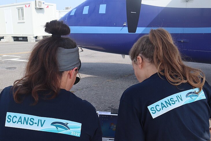 Two female researchers prepareing an observation flight.